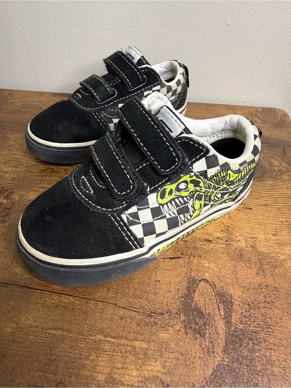 Vans Black & White Checkerboard Kids Sneakers with Neon Yellow Dinosaur Skeleton